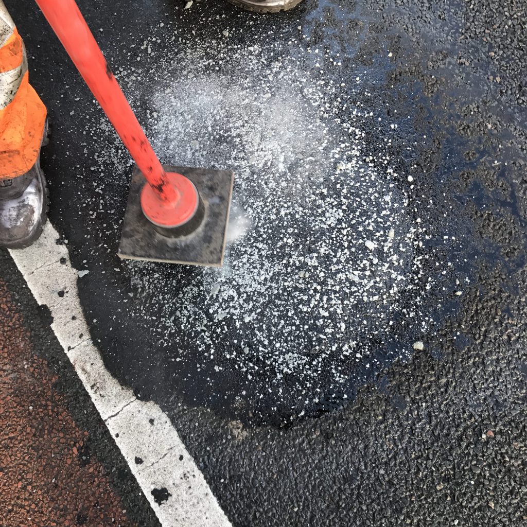 asfalt laten repareren